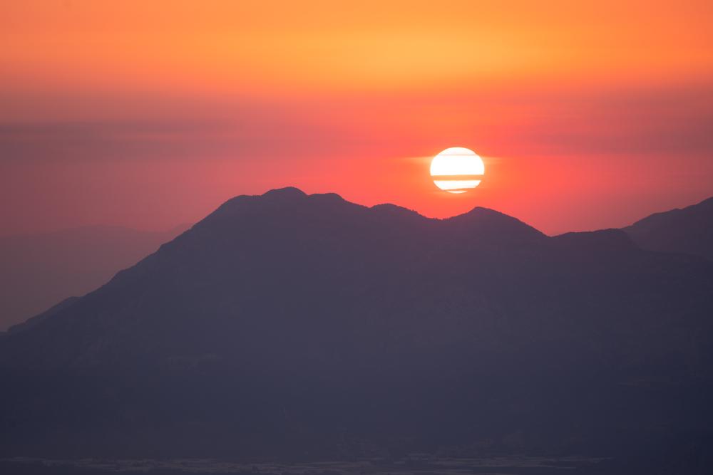 Burning sunset over the mountains of Patara beach, Turkey