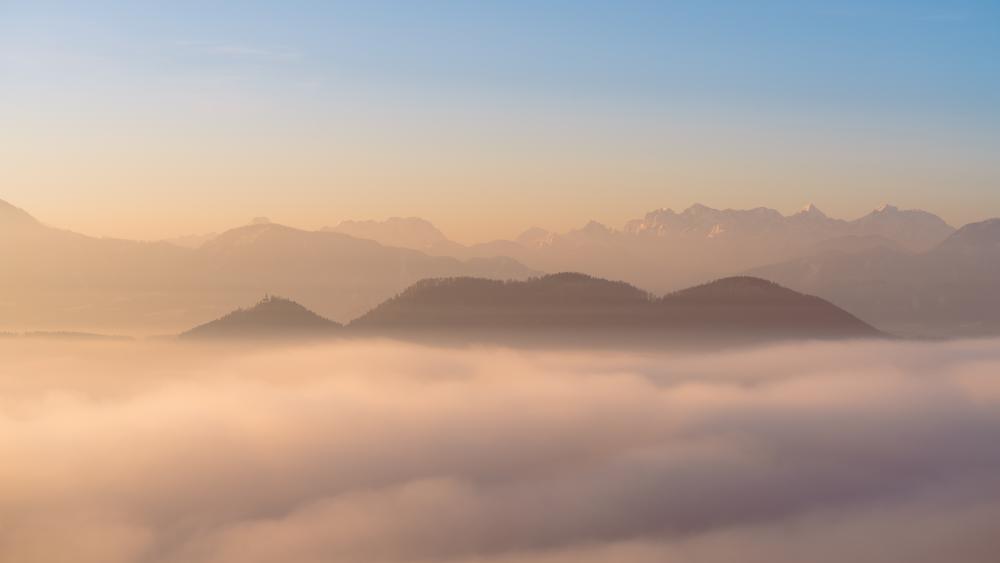 Lonely church on a peak above a sea of clouds, Carinthia, Austria