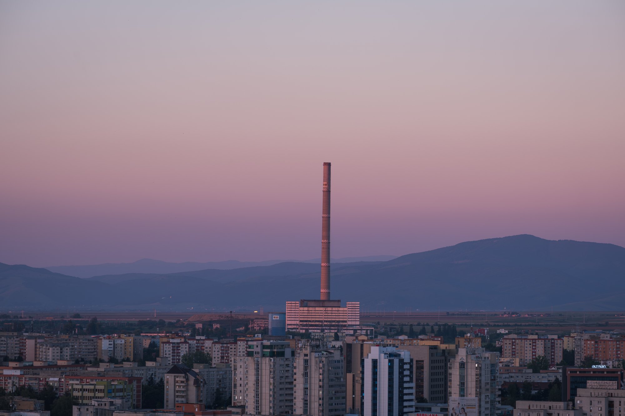Sunset over industrial complex in Bra\u0219ov, Romania