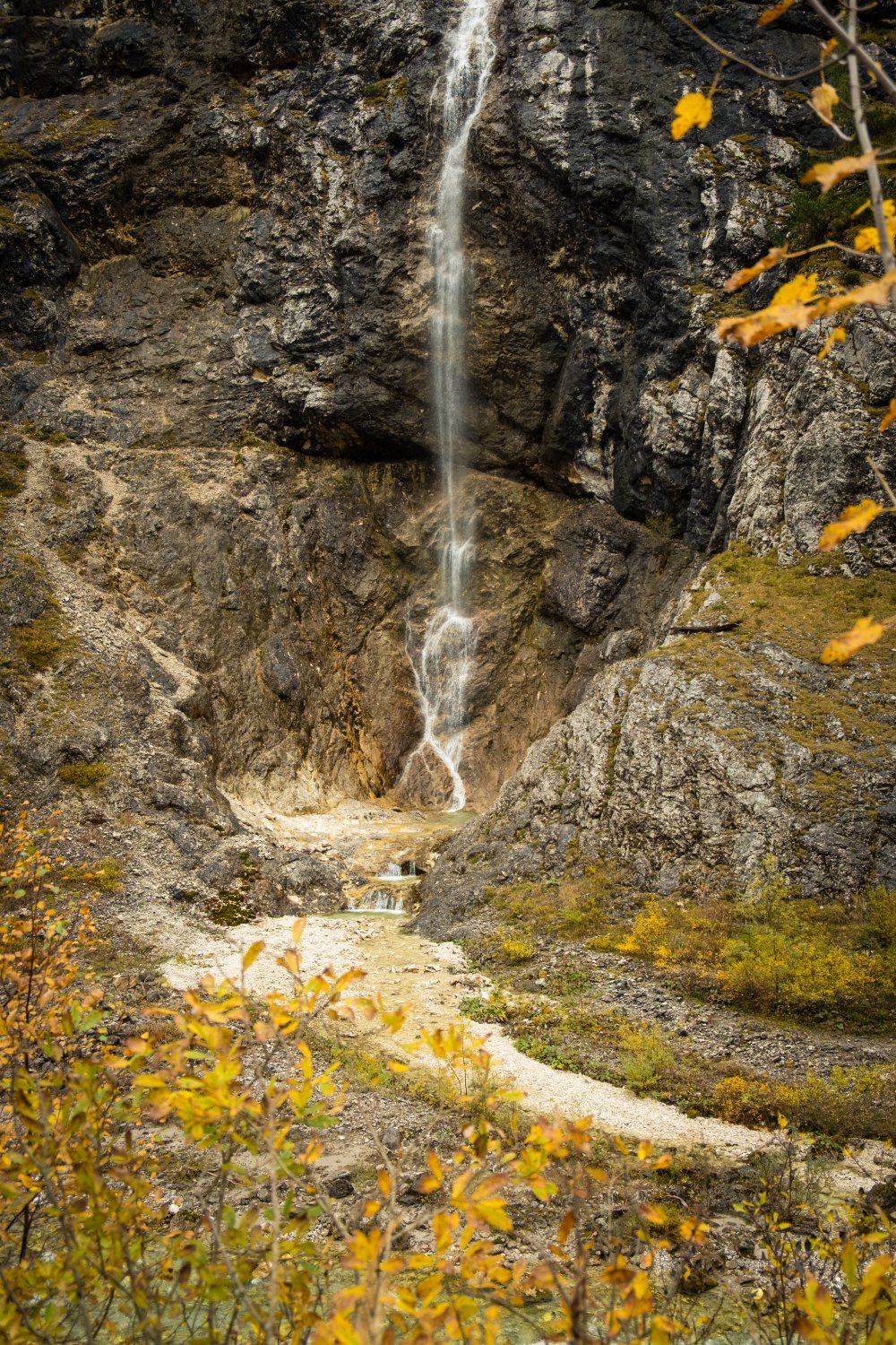 Autumn framed waterfall in the Karwendel Alps of Austria