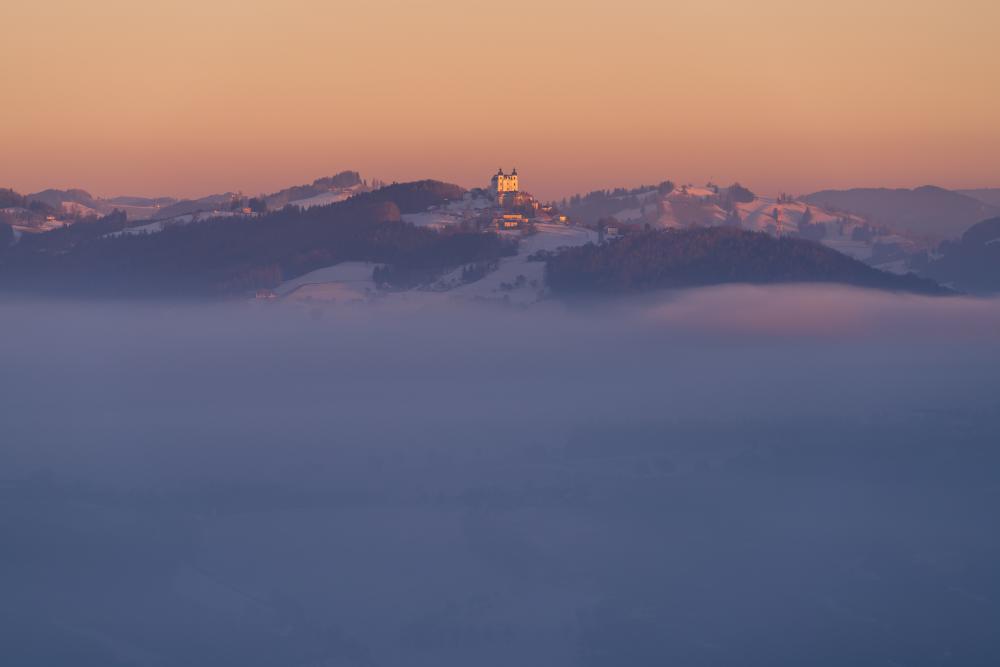 Sonntagberg floating above a sea of fog, Mostviertel, Austria